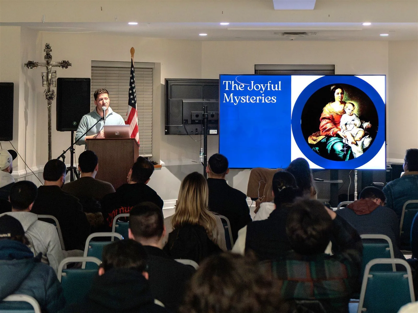 A Catholic formation event with a speaker addressing an audience