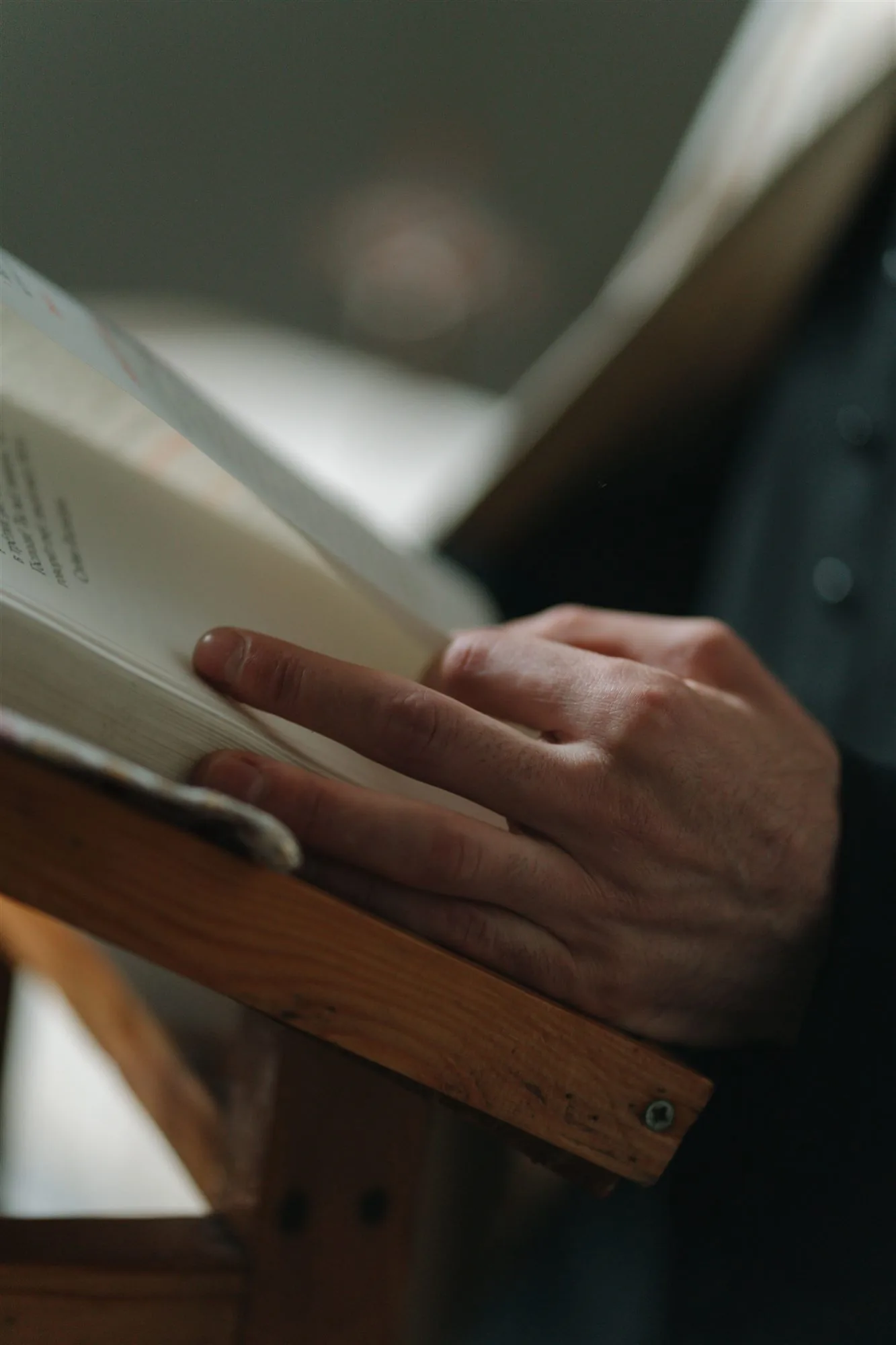 A person studying an open book