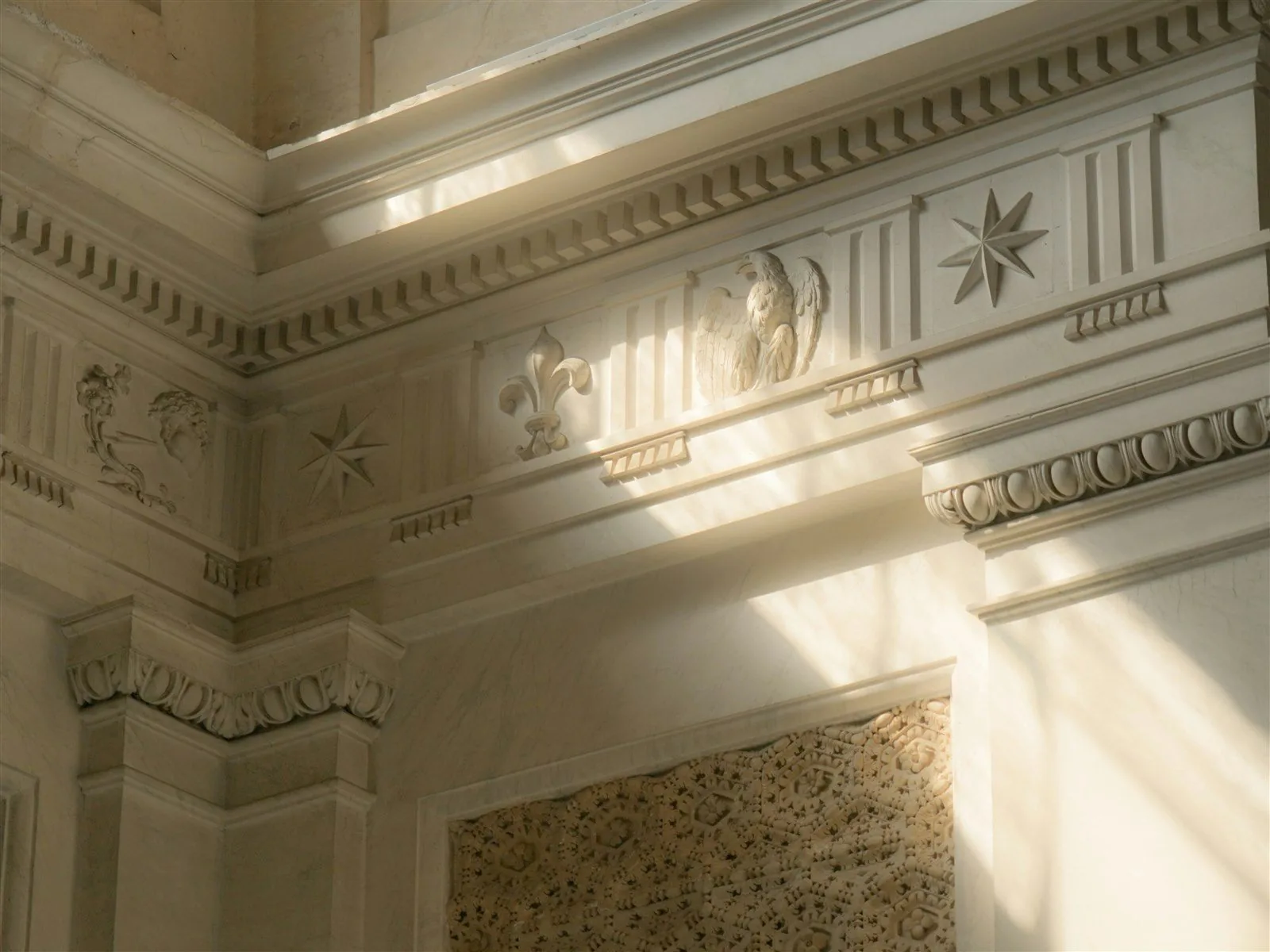 Sunlight falling across the carved stone interior of a church