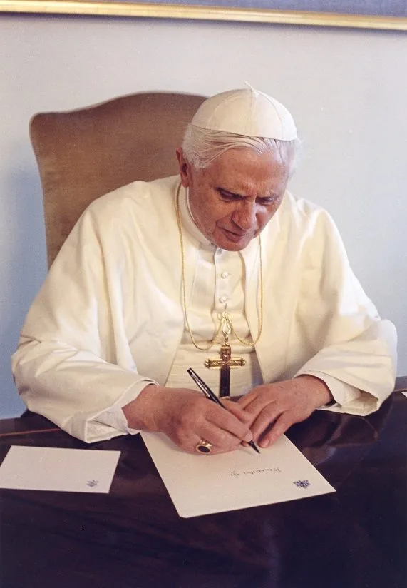 Pope Benedict XVI writing at his desk