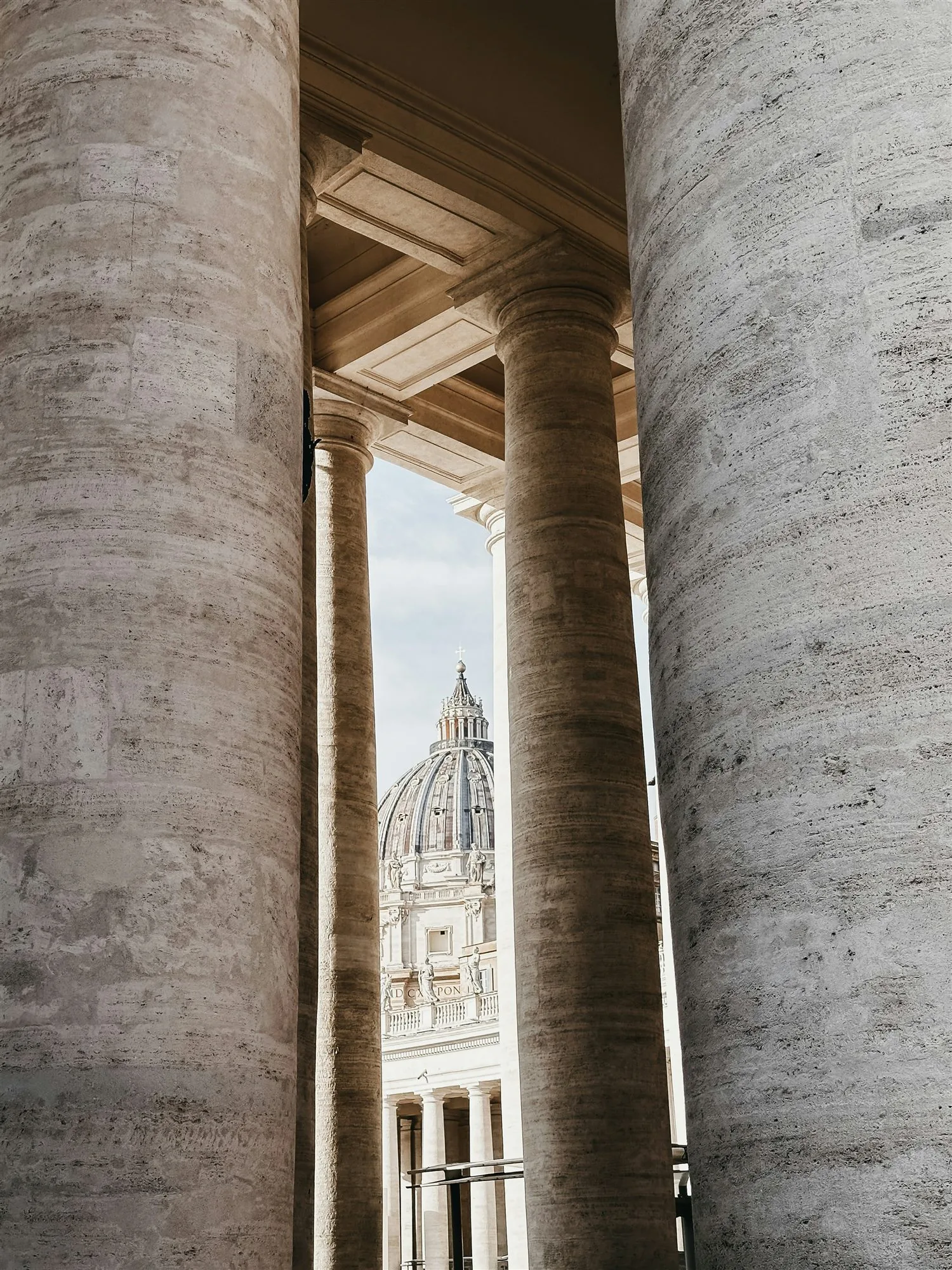The dome of St. Peter's Basilica framed by the colonnade