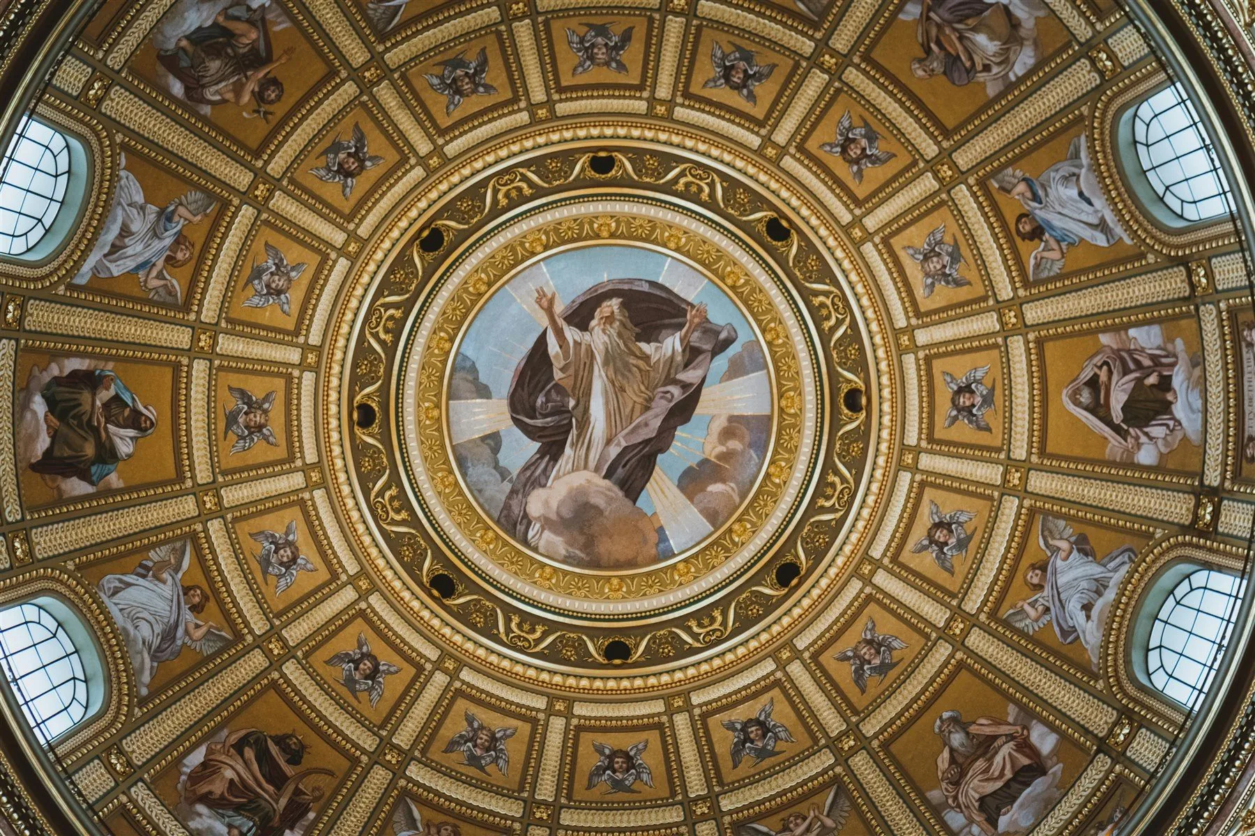 Ornate church dome with a central depiction of God the Father